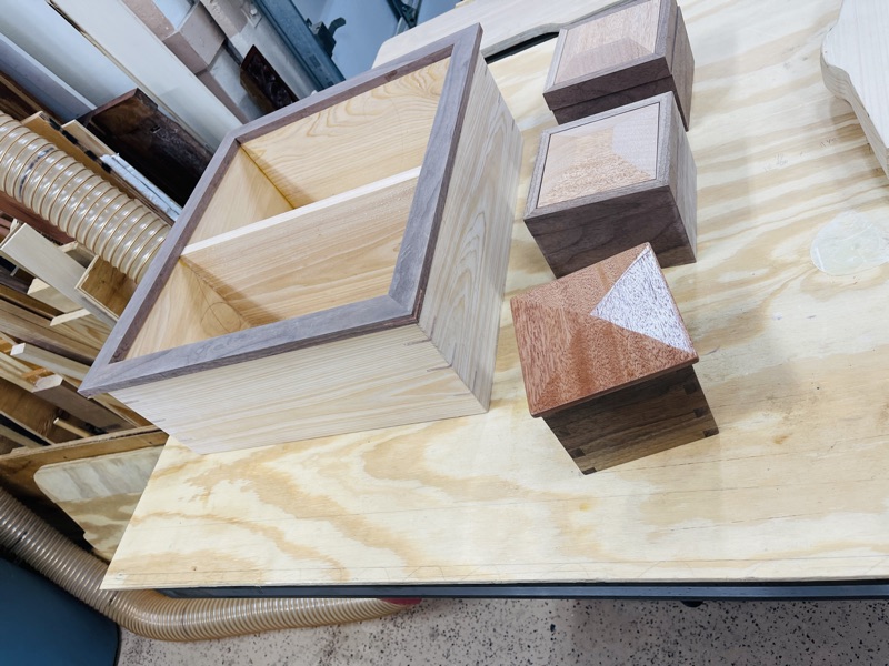 Keepsake box collection on workbench