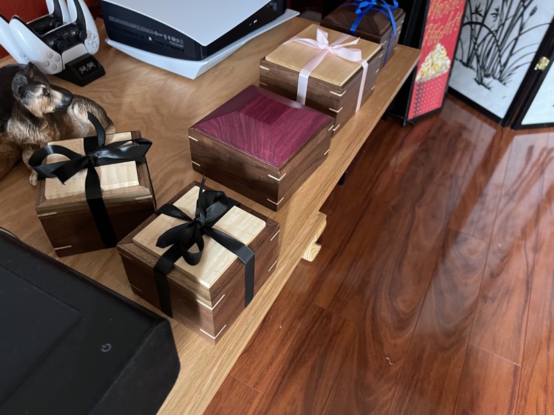 Gift-wrapped keepsake boxes with velvet lining