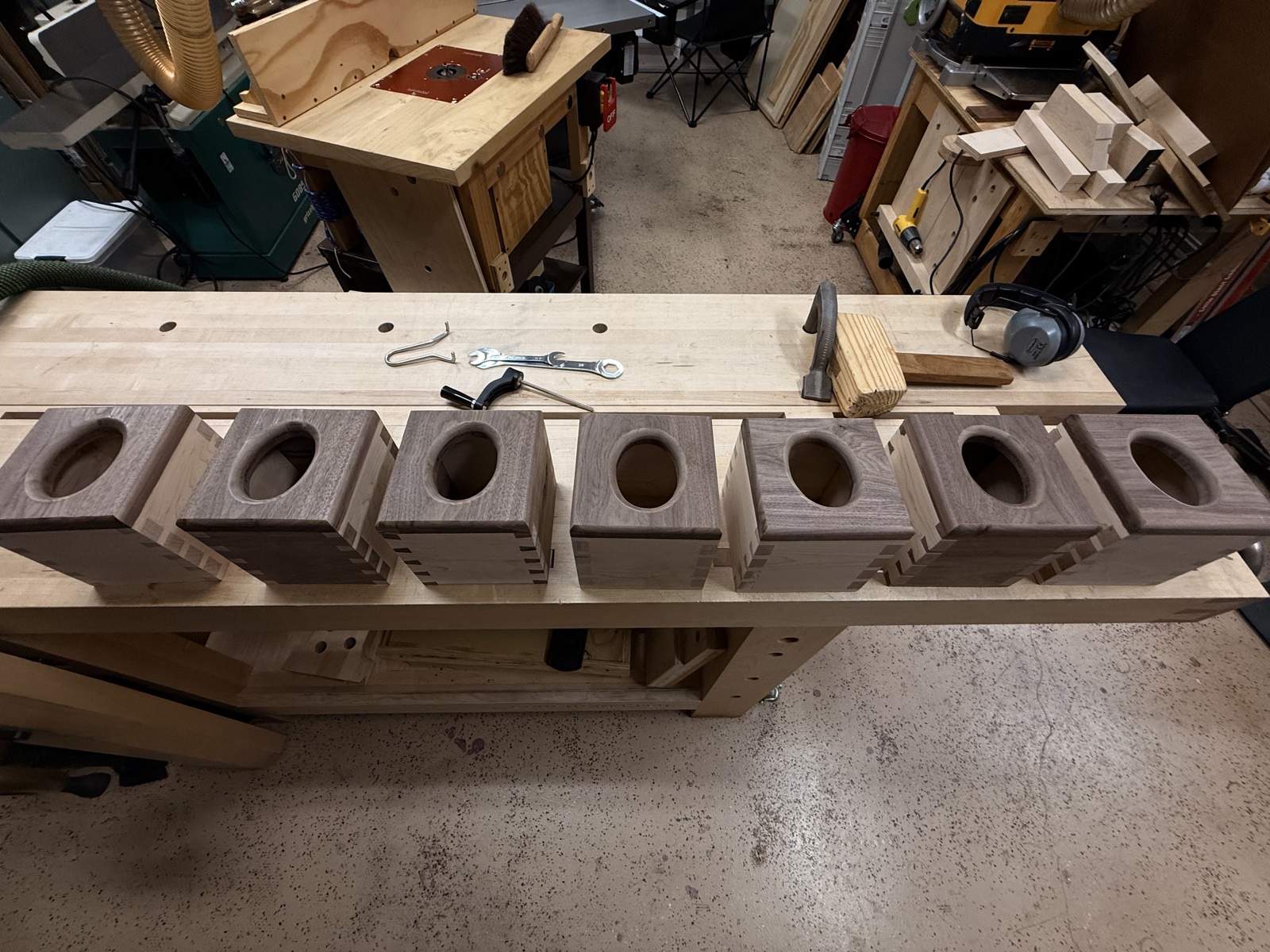 Walnut box blanks lined up on workbench before assembly