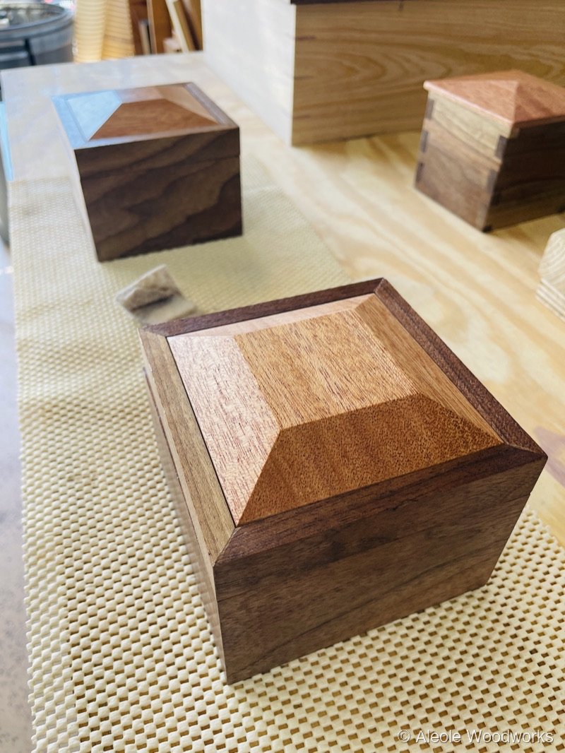 Walnut box with geometric mahogany inlay lid